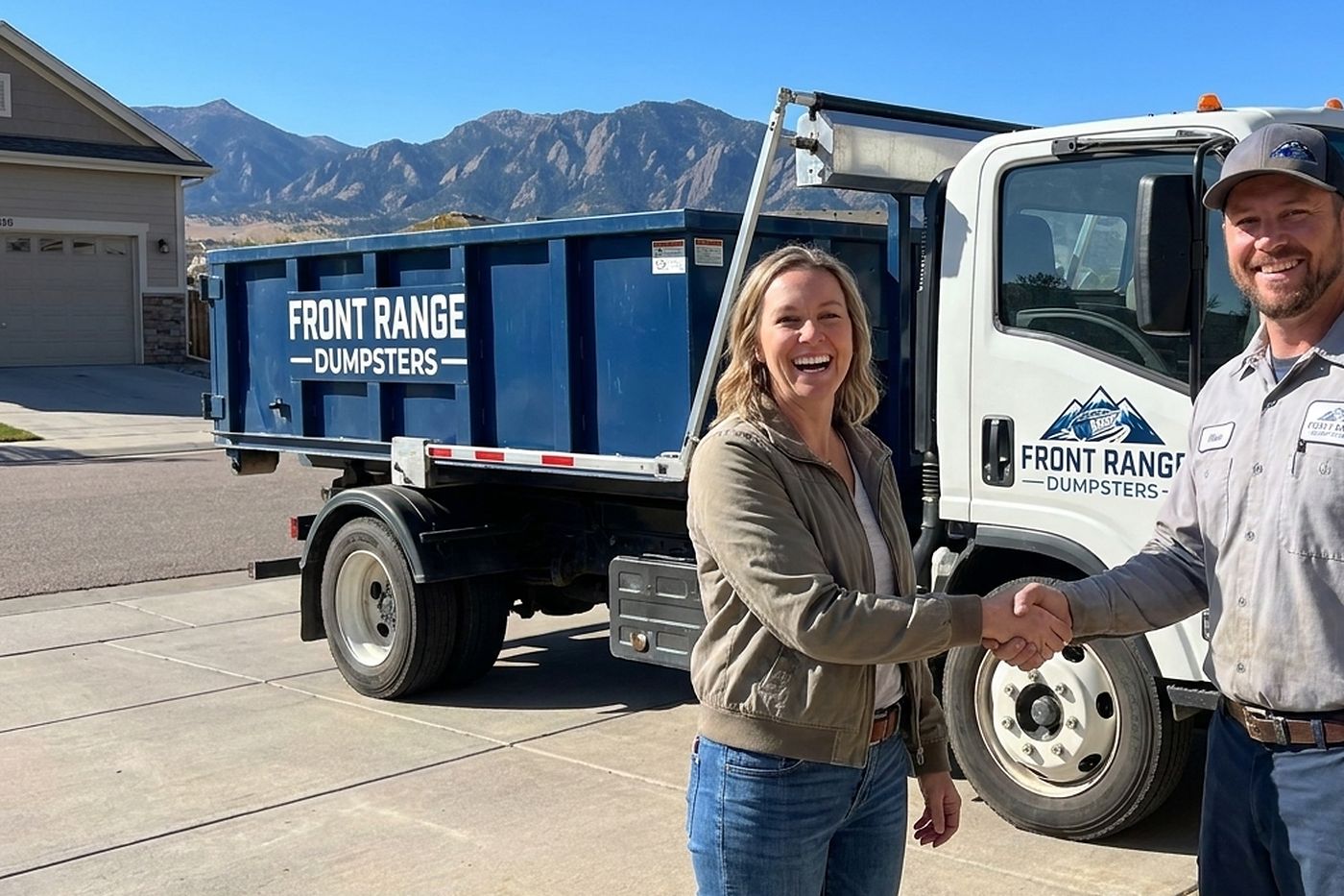 A Front Range Dumpsters roll-off truck at a customer&rsquo;s house after a same-day delivery